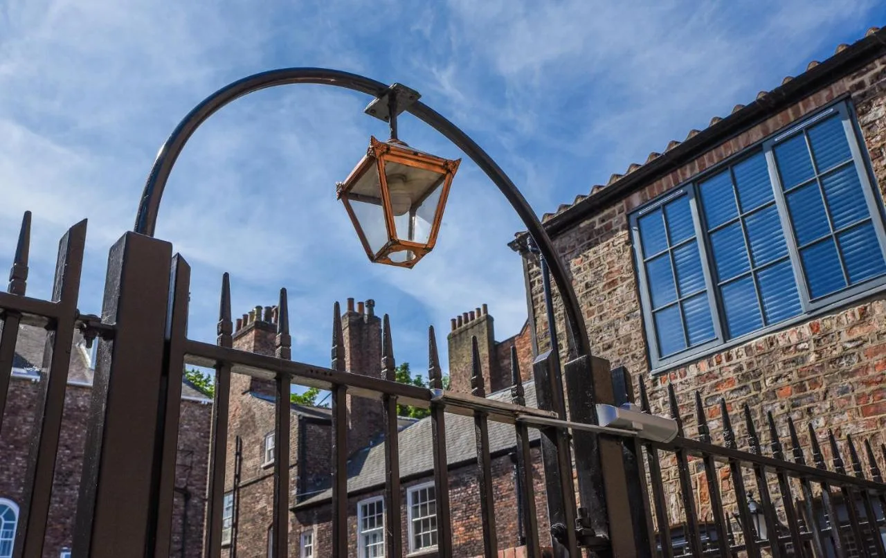 A street lamp on the iron fence outside The Lawrance Luxury Aparthotel on Micklegate